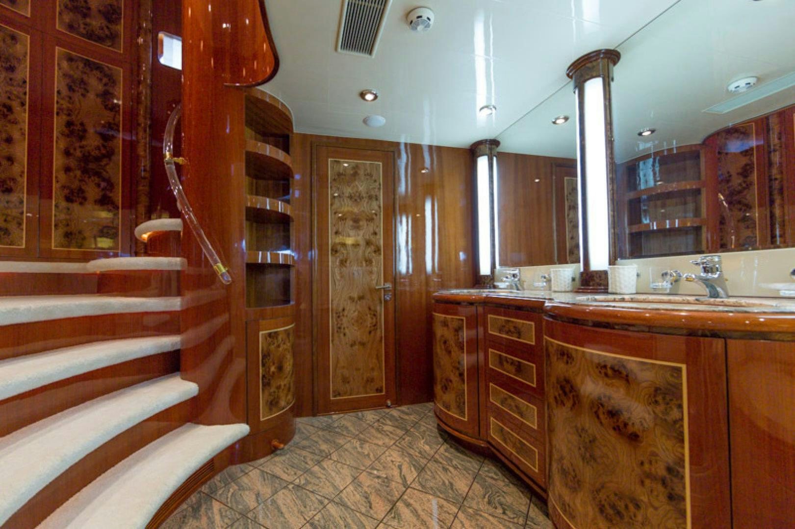 a bathroom with a sink and a staircase aboard MR. CAT Yacht for Sale