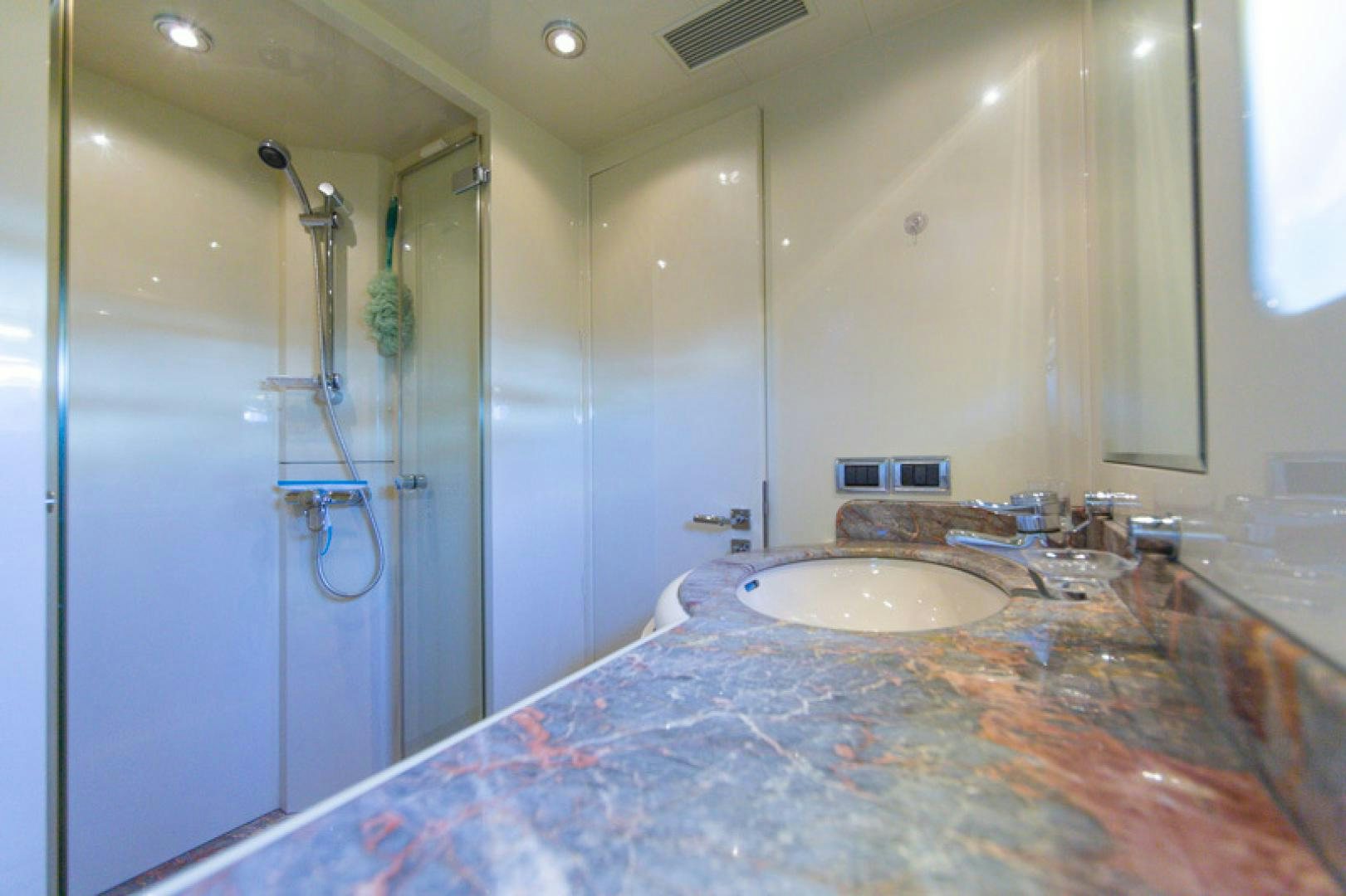 a bathroom with a large marble counter top aboard MR. CAT Yacht for Sale