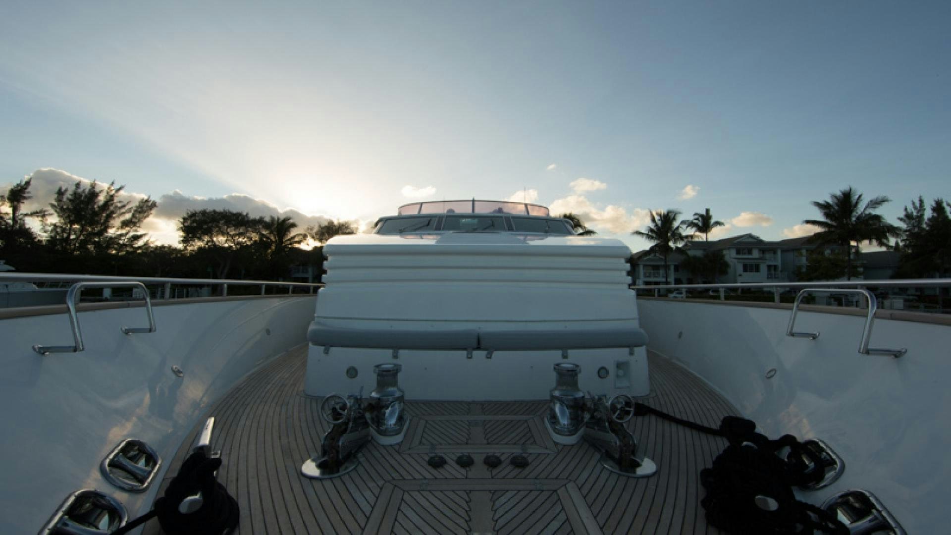 a white boat on a deck aboard MR. CAT Yacht for Sale