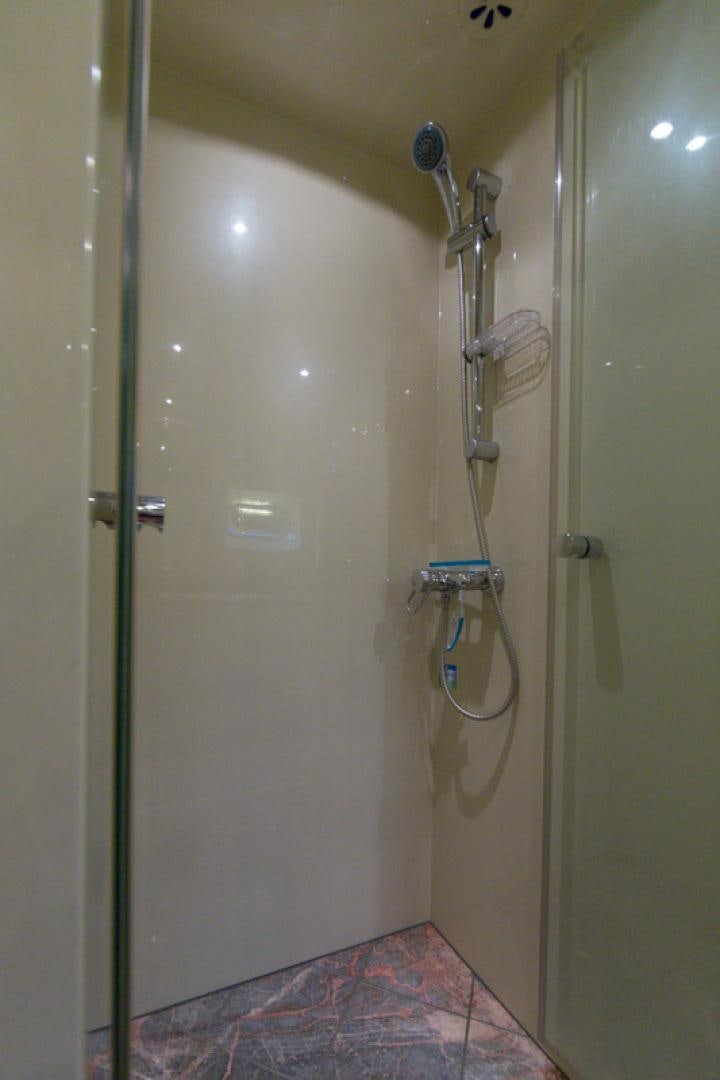 a shower with a red rug aboard MR. CAT Yacht for Sale