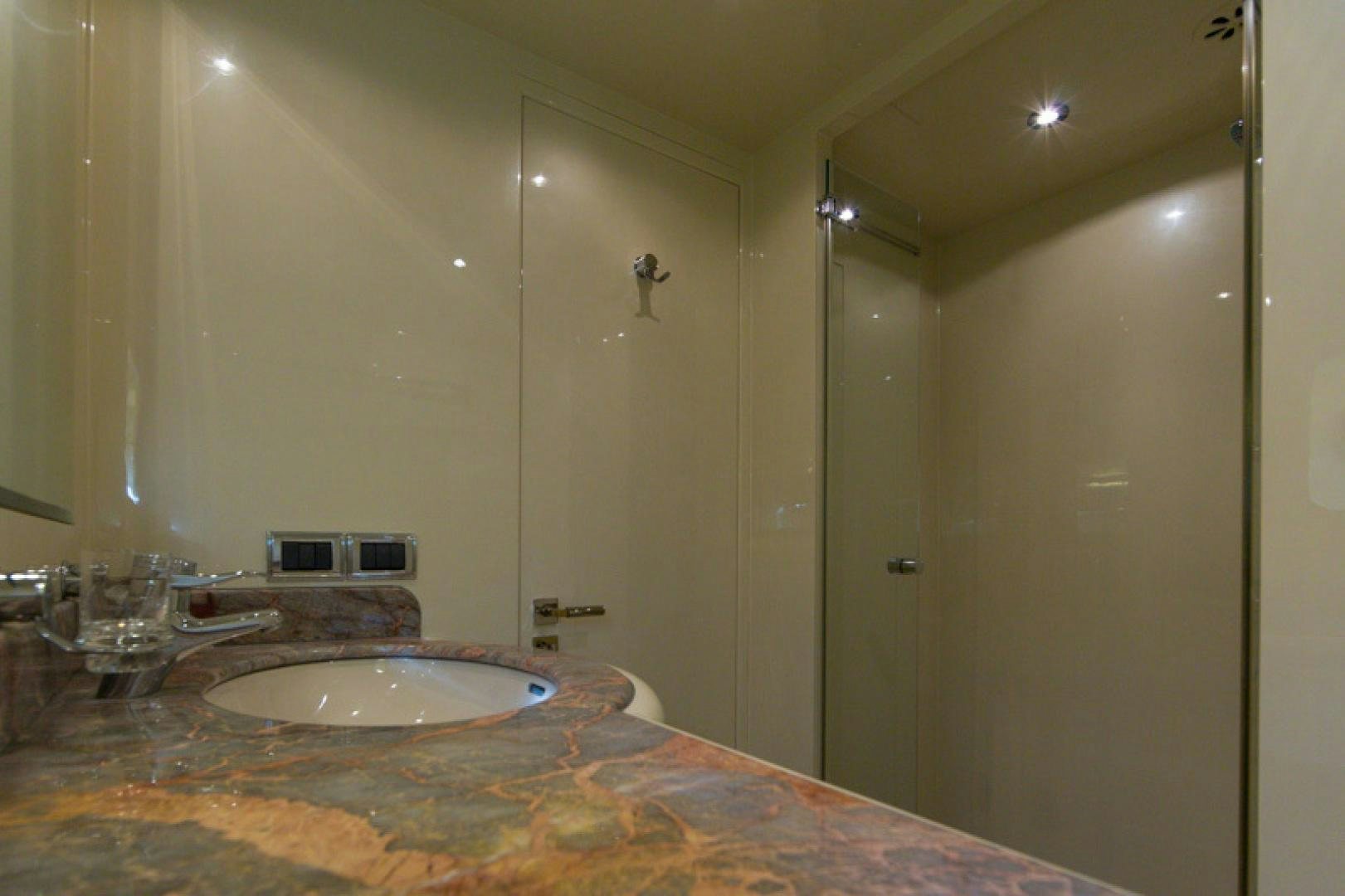 a bathroom with a large marble countertop aboard MR. CAT Yacht for Sale