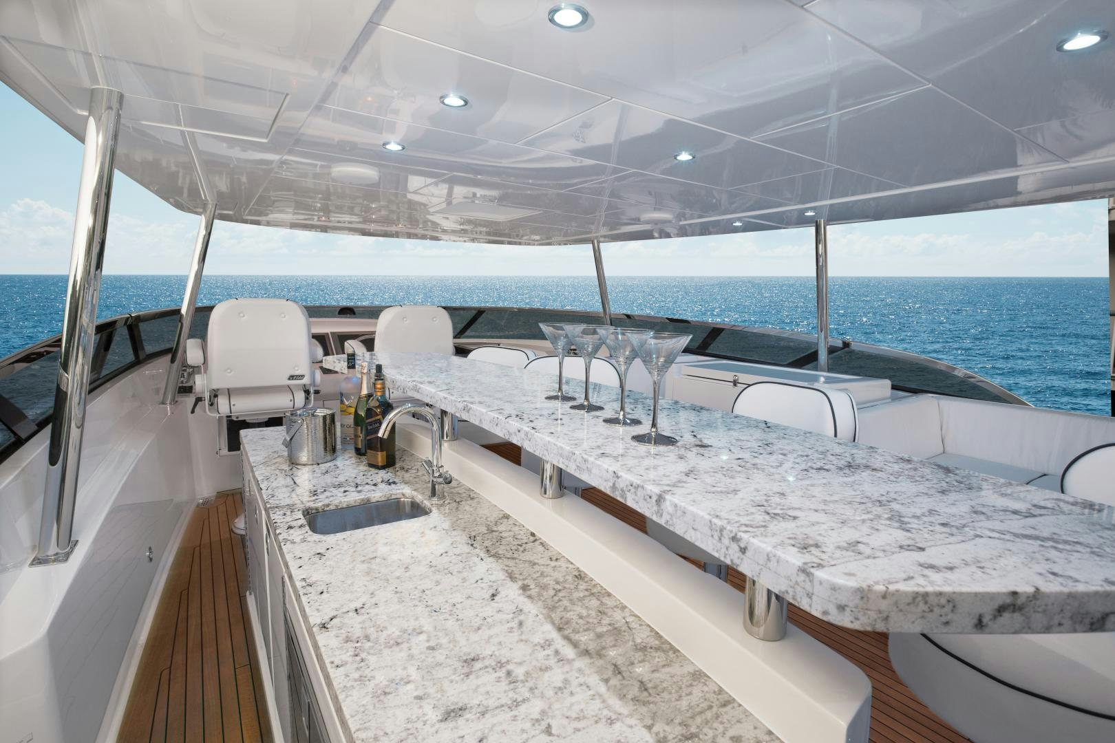 a boat on the water aboard 2021 HATTERAS 105RPH Yacht for Sale