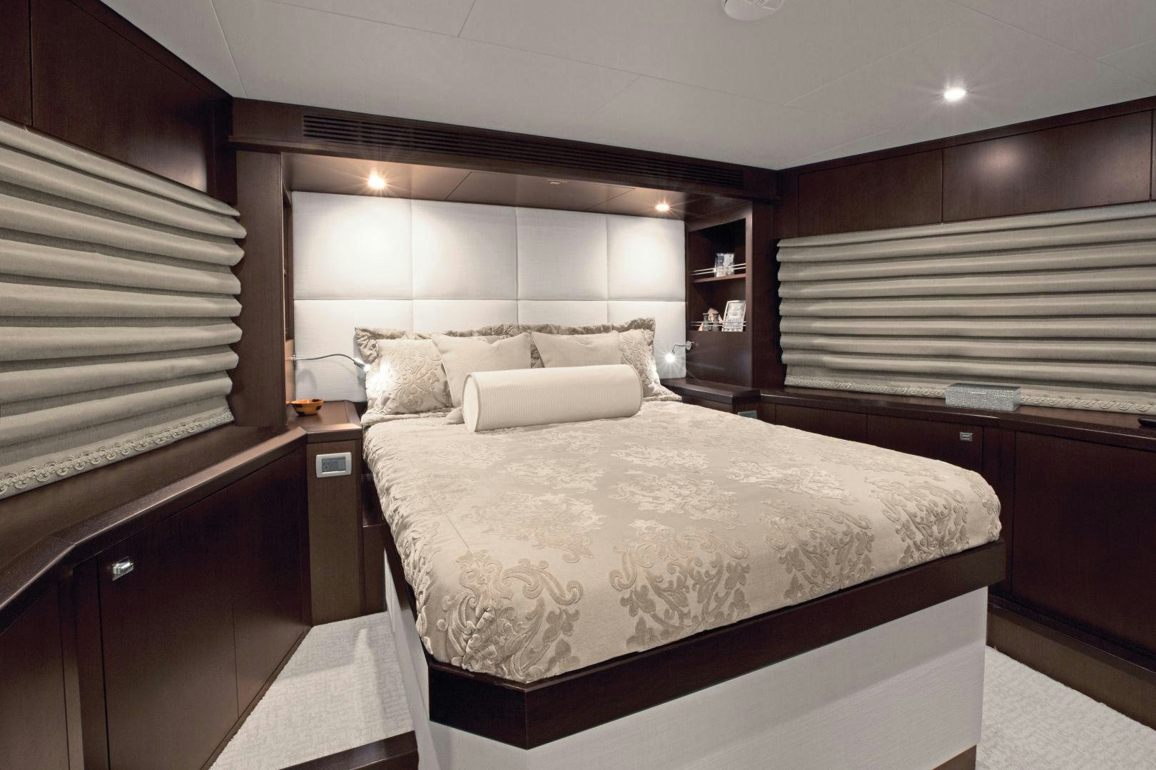 a couple of beds in a hotel room aboard 2021 HATTERAS 105RPH Yacht for Sale
