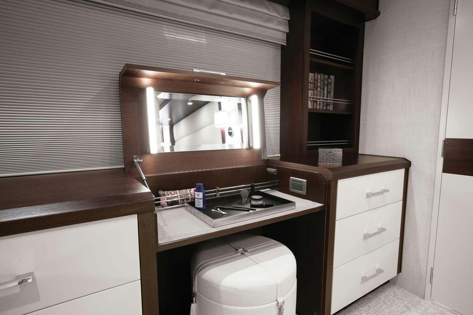 a small bathroom with a toilet and a sink aboard 2021 HATTERAS 105RPH Yacht for Sale