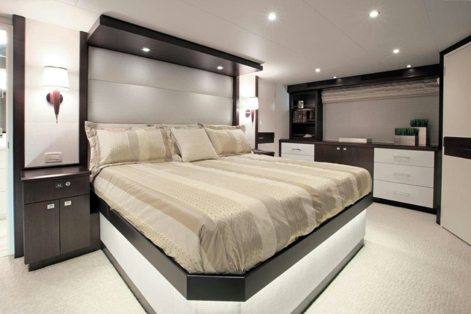 a large bed in a room aboard 105 RAISED PILOTHOUSE Yacht for Sale