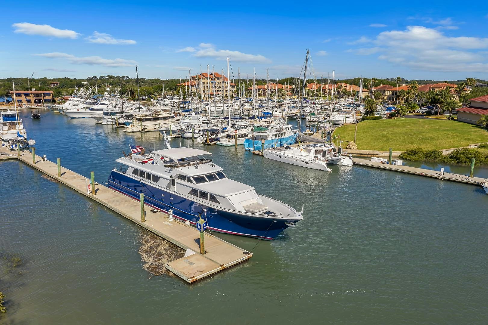 boats docked at a pier aboard LA VIDA Yacht for Sale