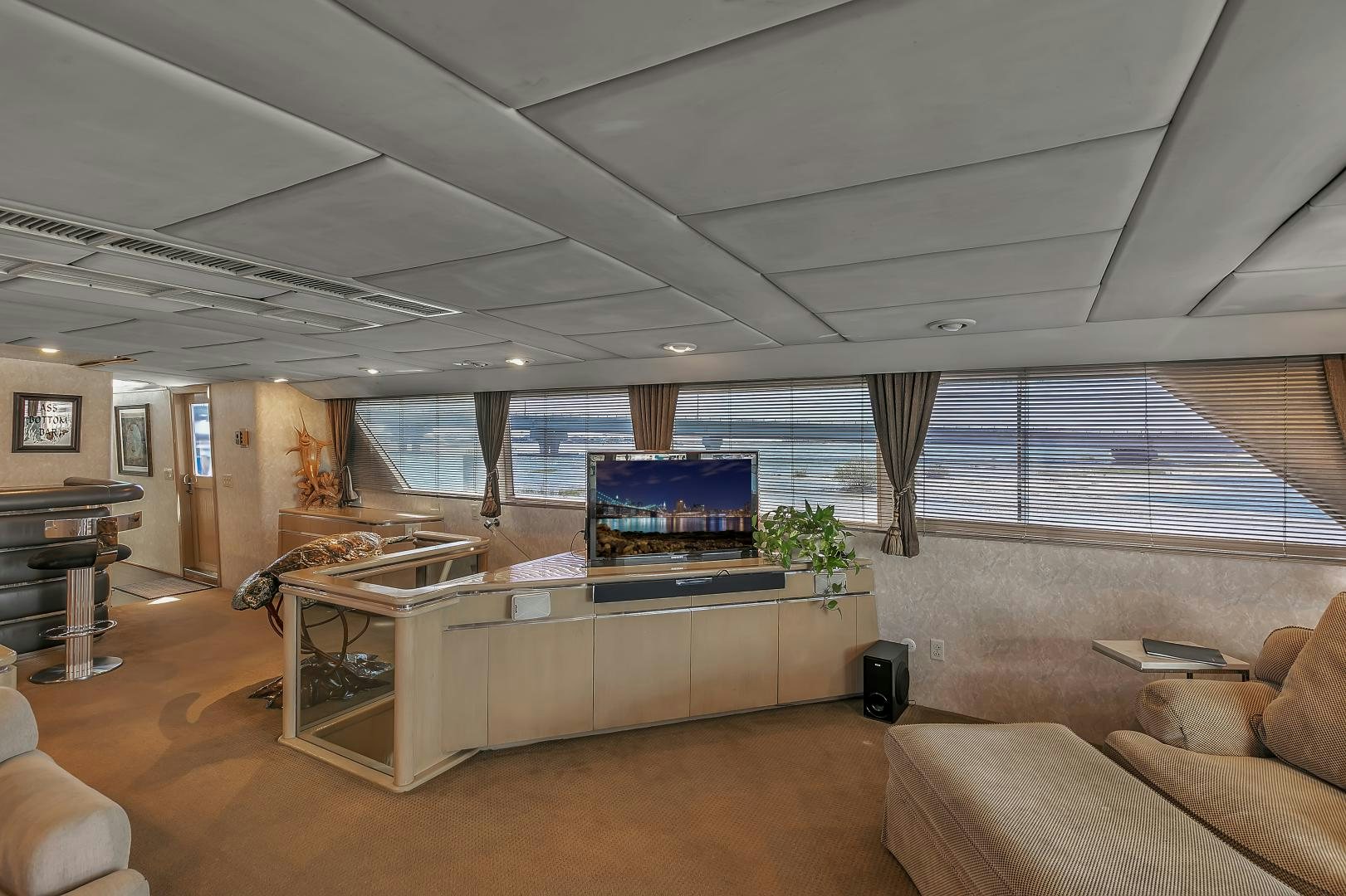 a large living room with a large window aboard LA VIDA Yacht for Sale