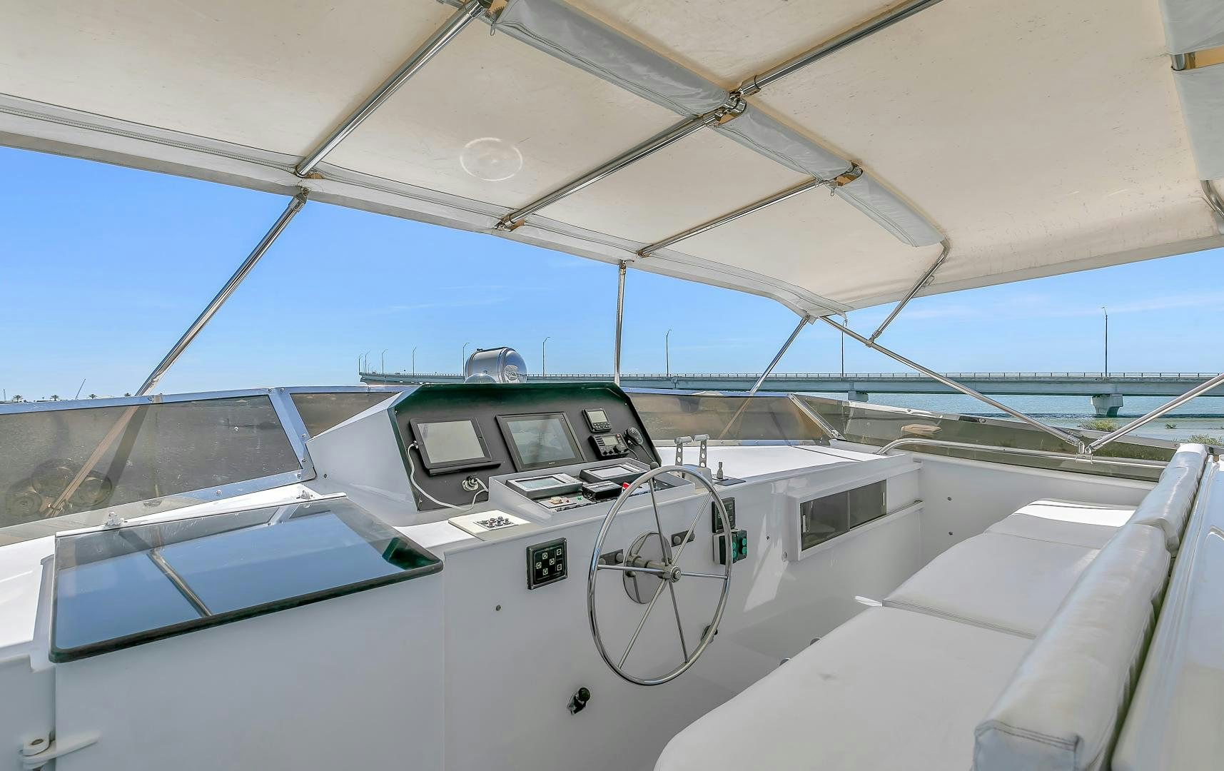 a white car with a door open aboard LA VIDA Yacht for Sale