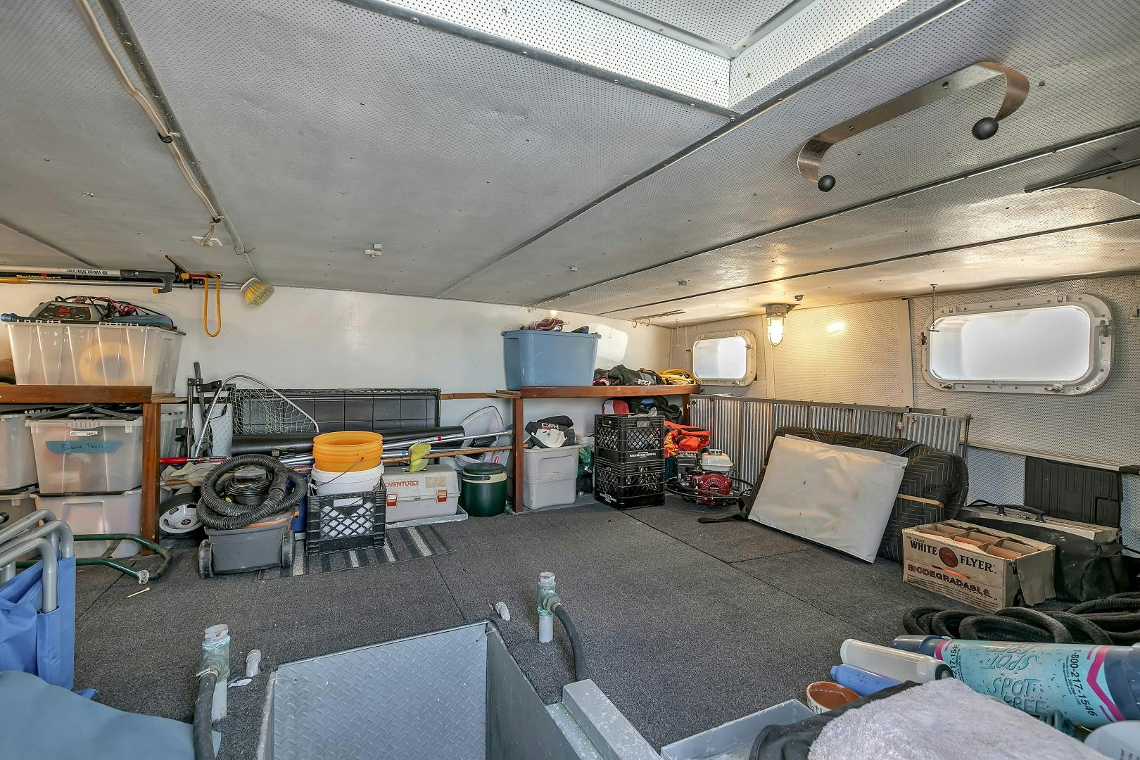 a room with a lot of tools and equipment in it aboard LA VIDA Yacht for Sale