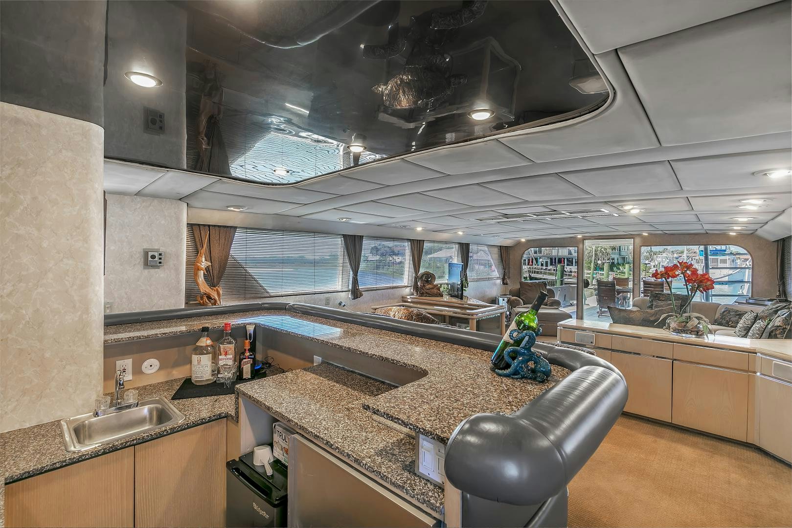 a kitchen with a large window aboard LA VIDA Yacht for Sale