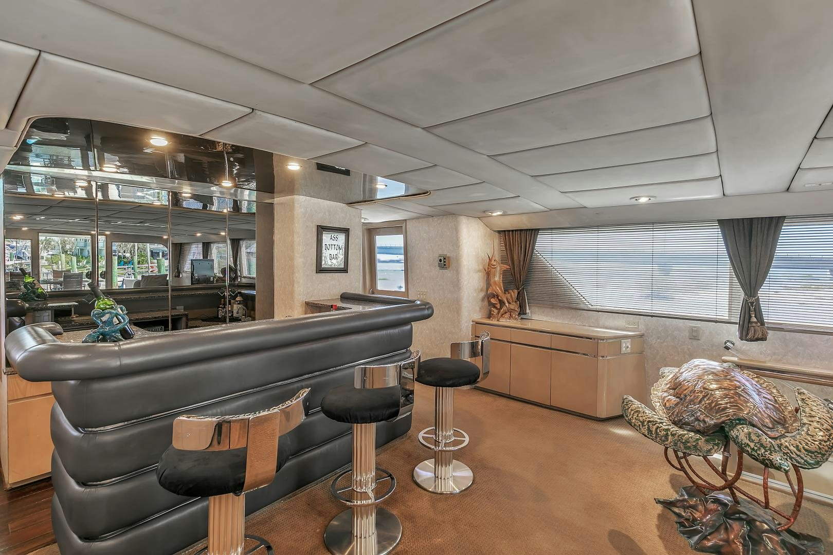 a living room with a piano and a piano aboard LA VIDA Yacht for Sale