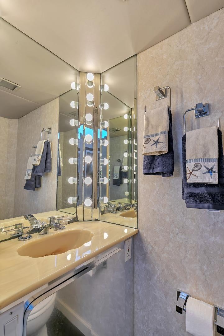 a bathroom with a large mirror aboard LA VIDA Yacht for Sale