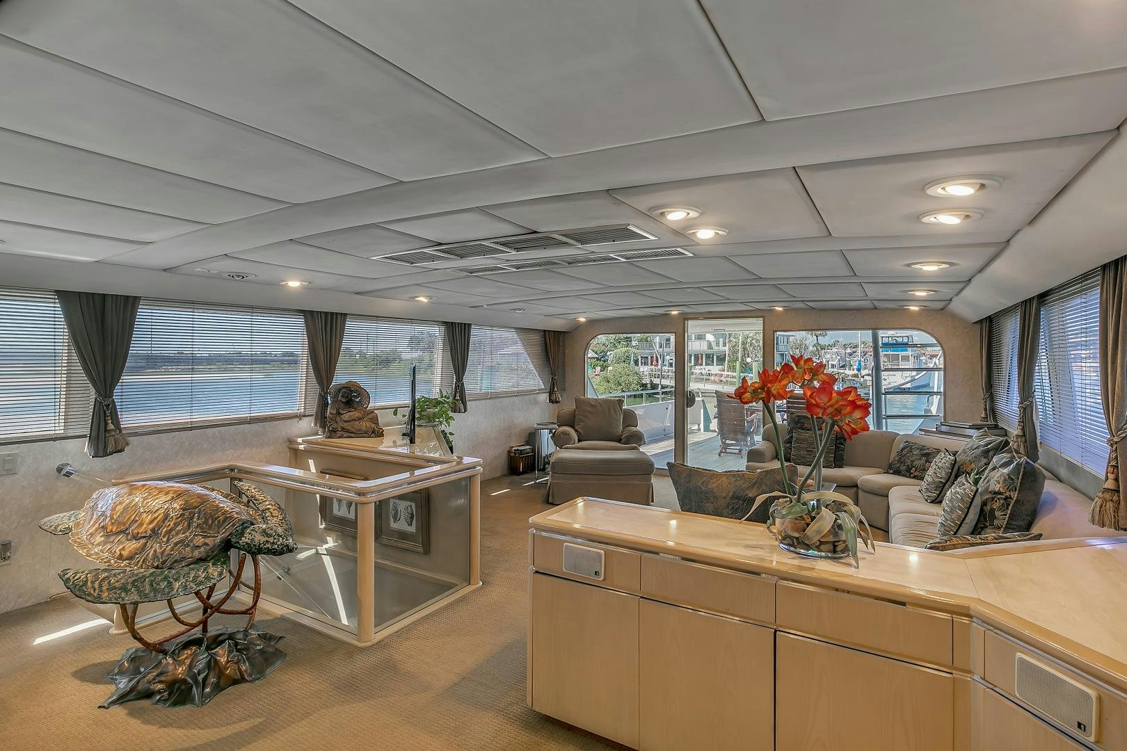 a living room with a large window aboard LA VIDA Yacht for Sale