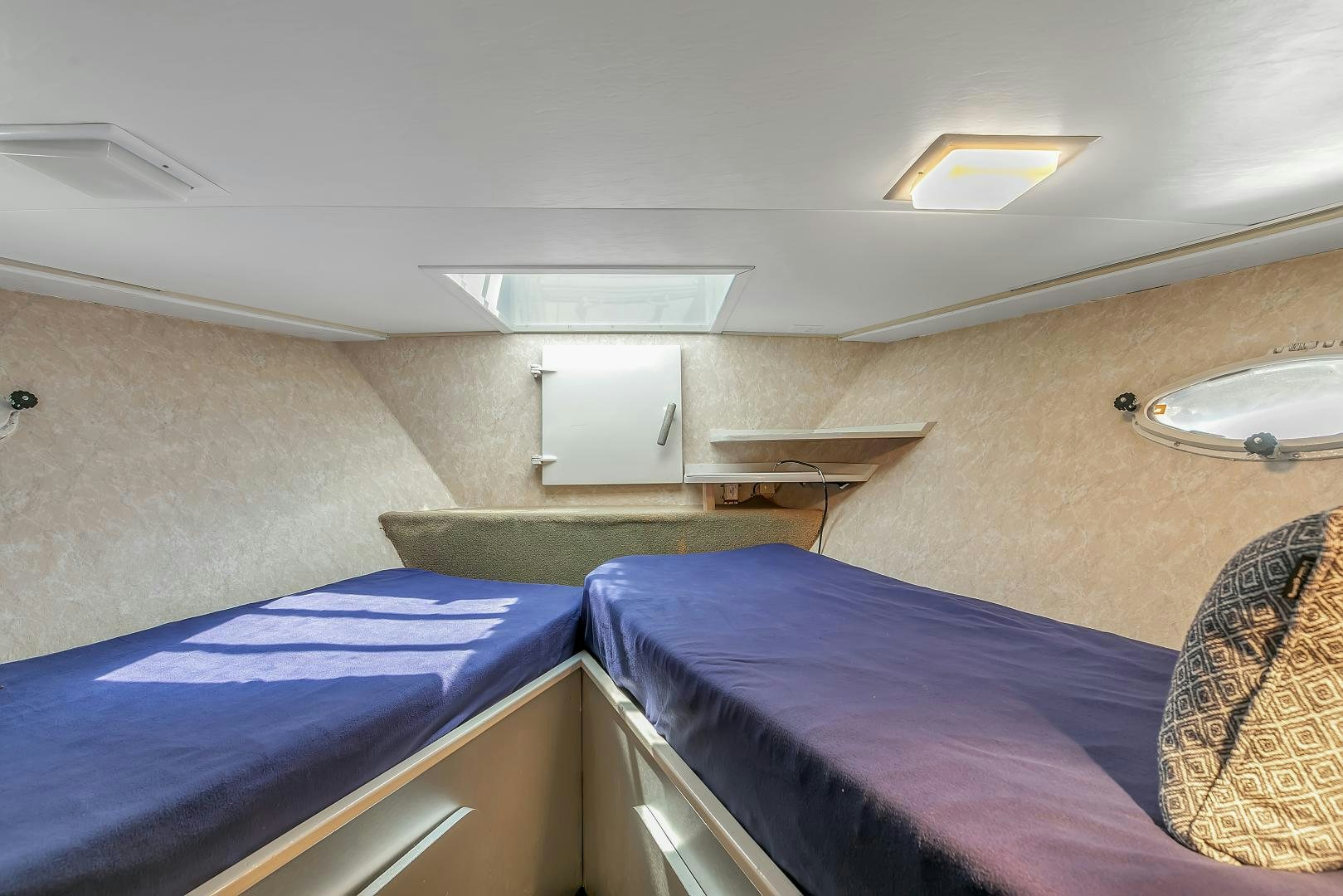 a room with bunk beds aboard LA VIDA Yacht for Sale