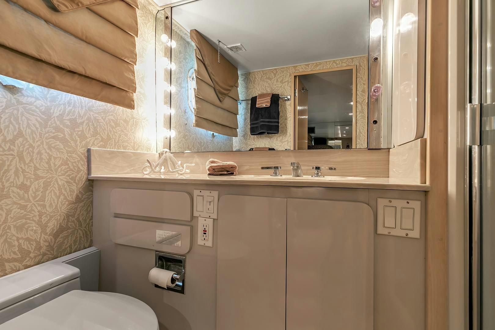 a bathroom with a sink and a toilet aboard LA VIDA Yacht for Sale