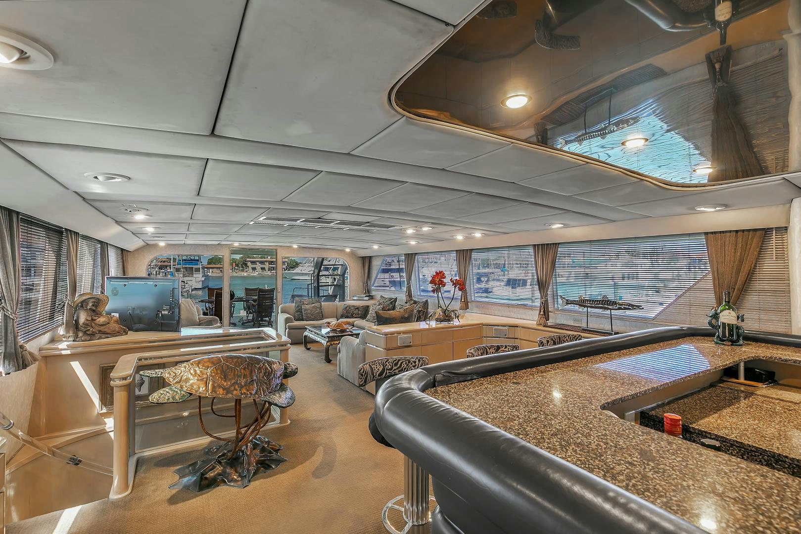 a room with a table and chairs aboard LA VIDA Yacht for Sale