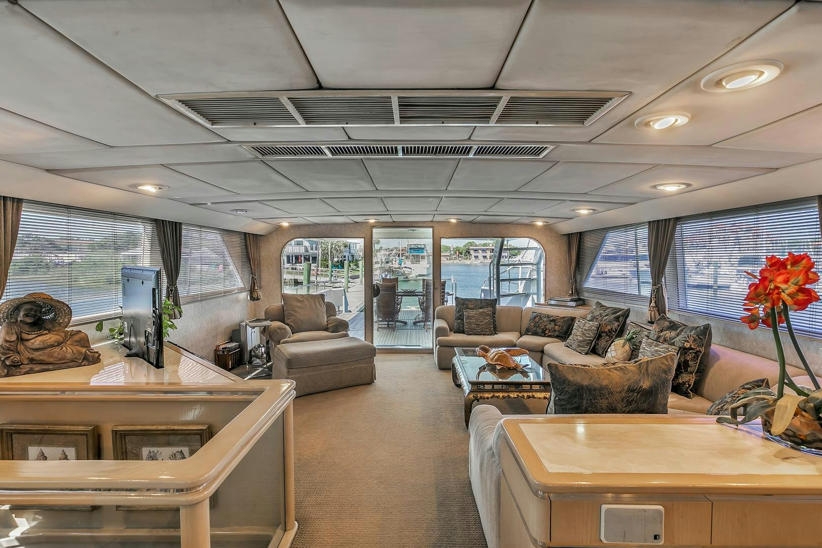 a room with a couch and a desk and a computer aboard LA VIDA Yacht for Sale