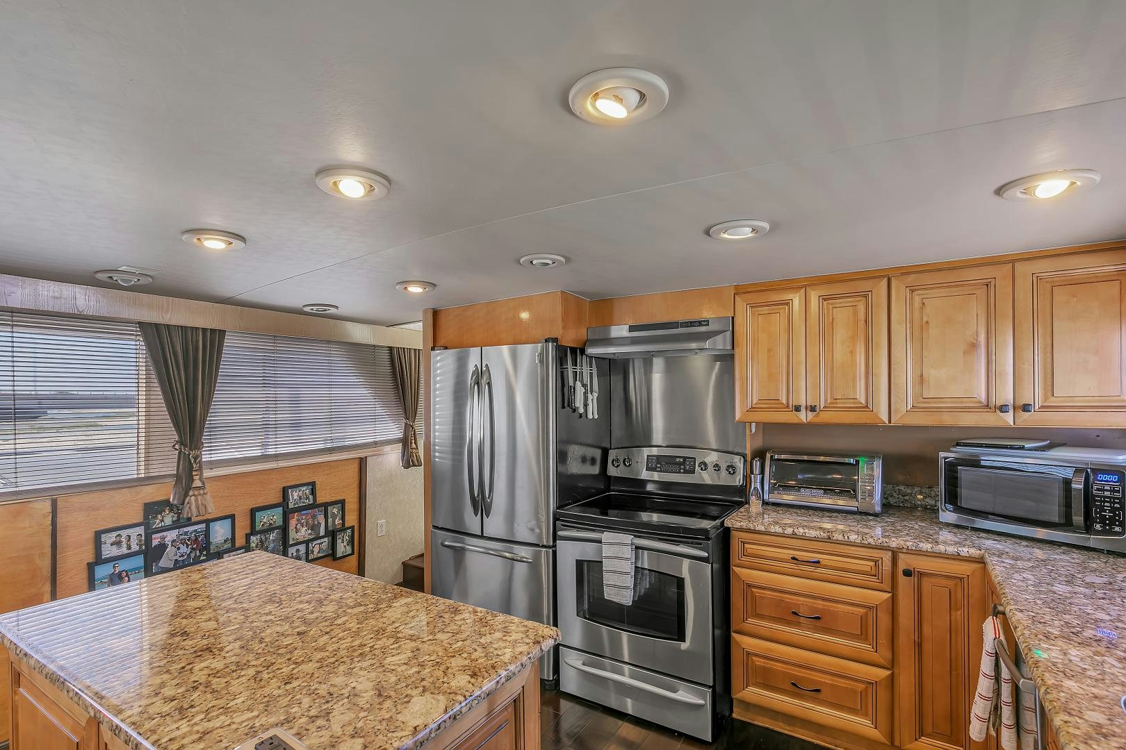a kitchen with granite counter tops aboard LA VIDA Yacht for Sale