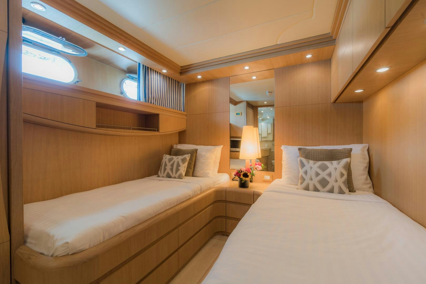 a room with a bed and a mirror aboard AVELINE Yacht for Sale