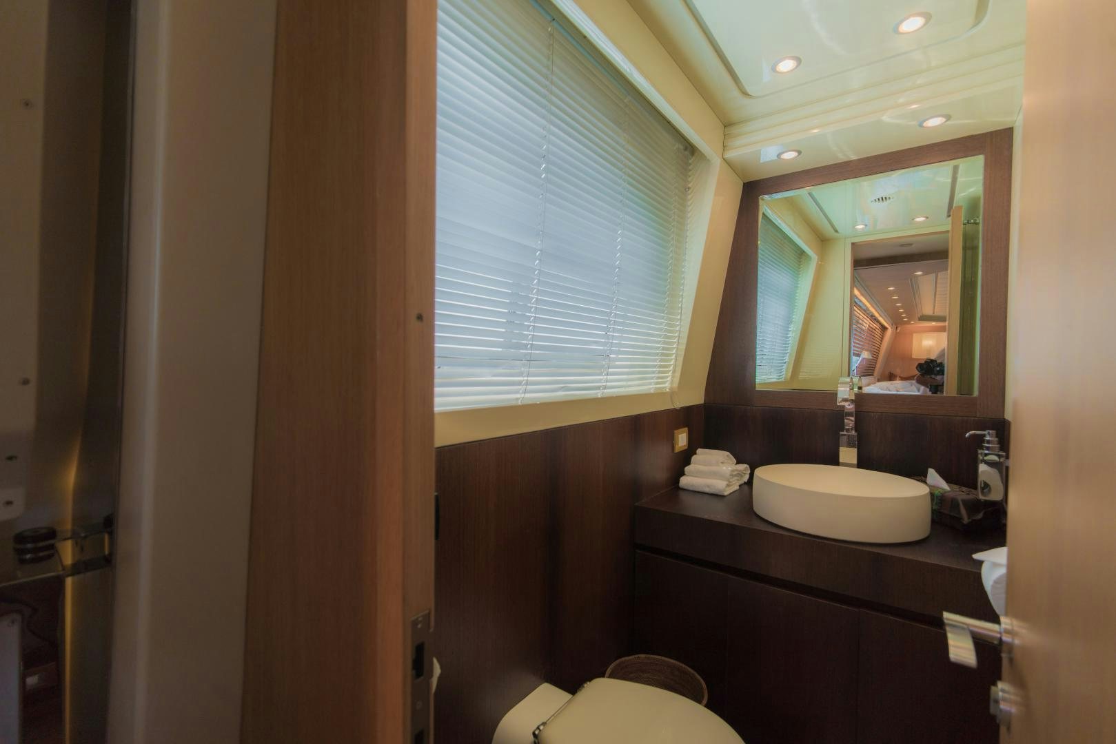 a bathroom with a sink and a mirror aboard AVELINE Yacht for Sale