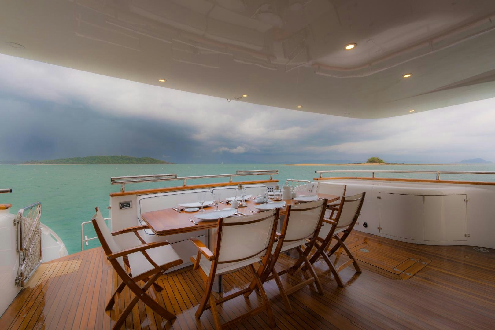 a dining table set for a dinner party aboard AVELINE Yacht for Sale