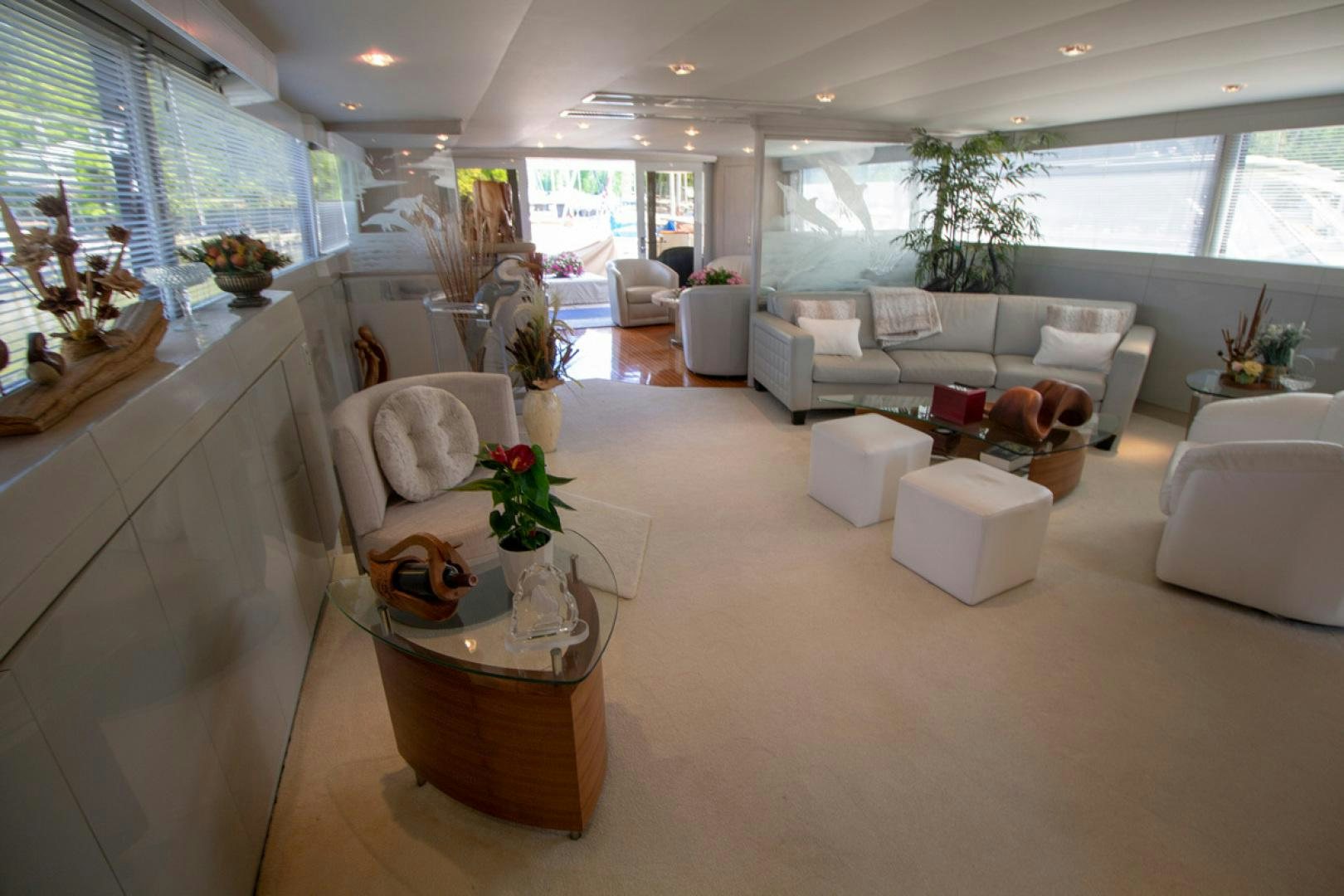 a living room with a large window aboard LIQUIDITY Yacht for Sale