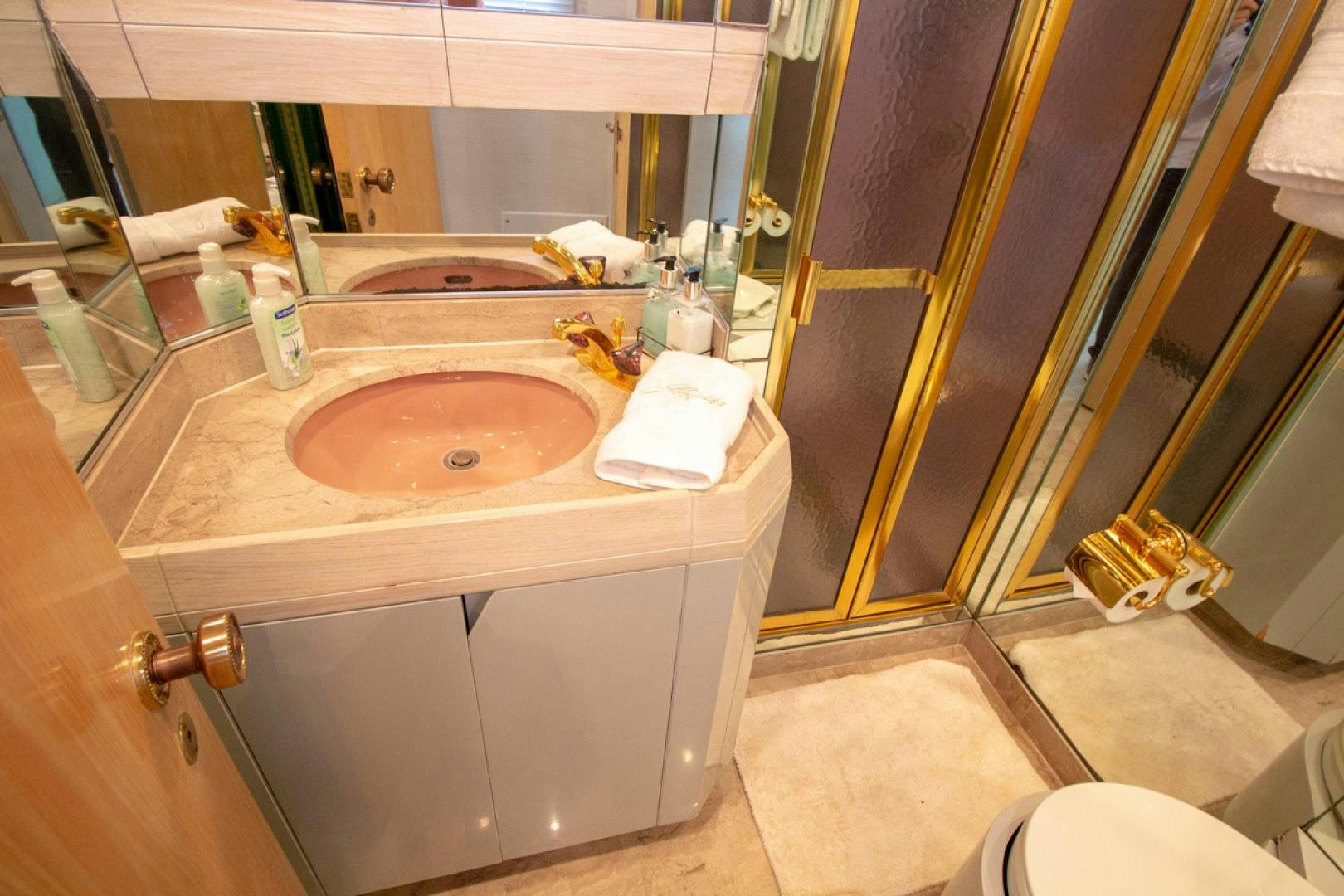 a bathroom with a sink and a mirror aboard LIQUIDITY Yacht for Sale