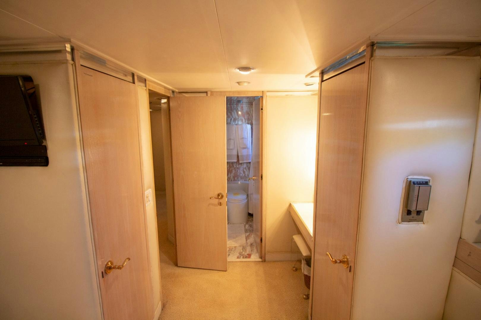 a room with a door and a mirror aboard LIQUIDITY Yacht for Sale