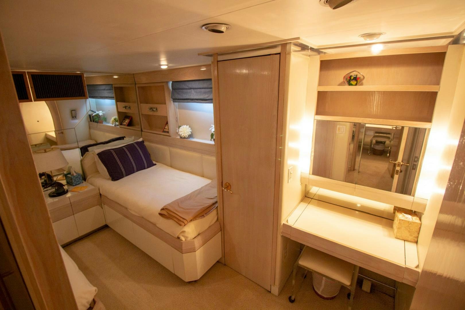 a room with a bed and a desk aboard LIQUIDITY Yacht for Sale