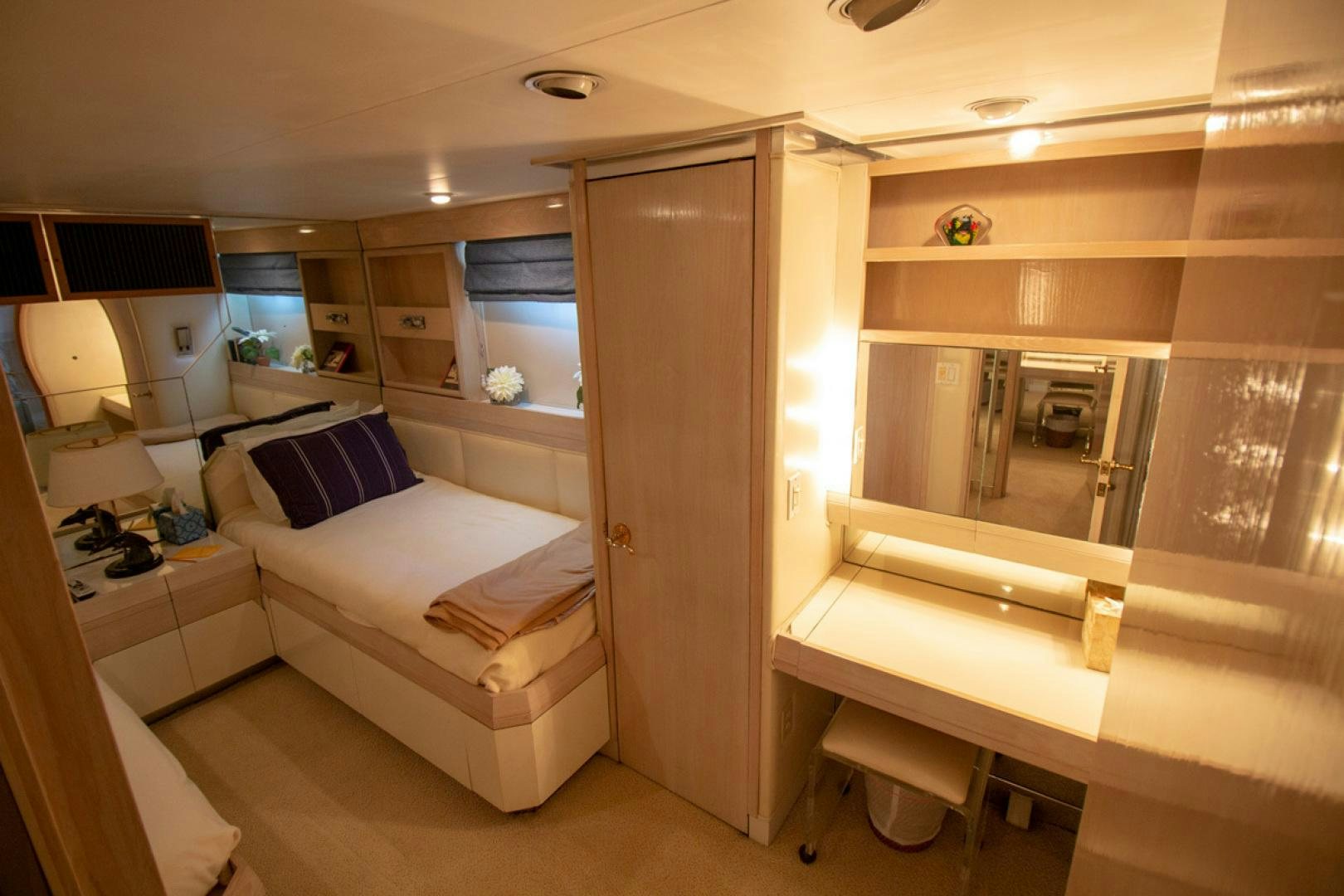 a room with a bed and a desk aboard LIQUIDITY Yacht for Sale