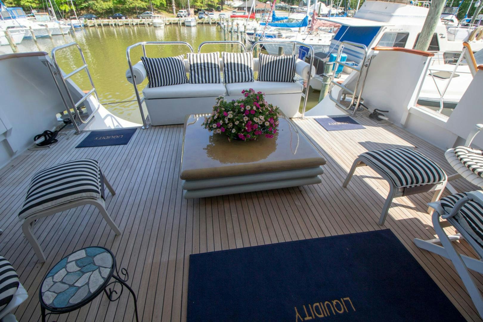 a boat with a flower pot on it aboard LIQUIDITY Yacht for Sale
