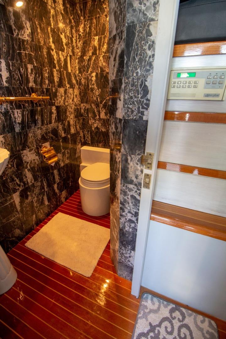 a bathroom with a shower aboard LIQUIDITY Yacht for Sale