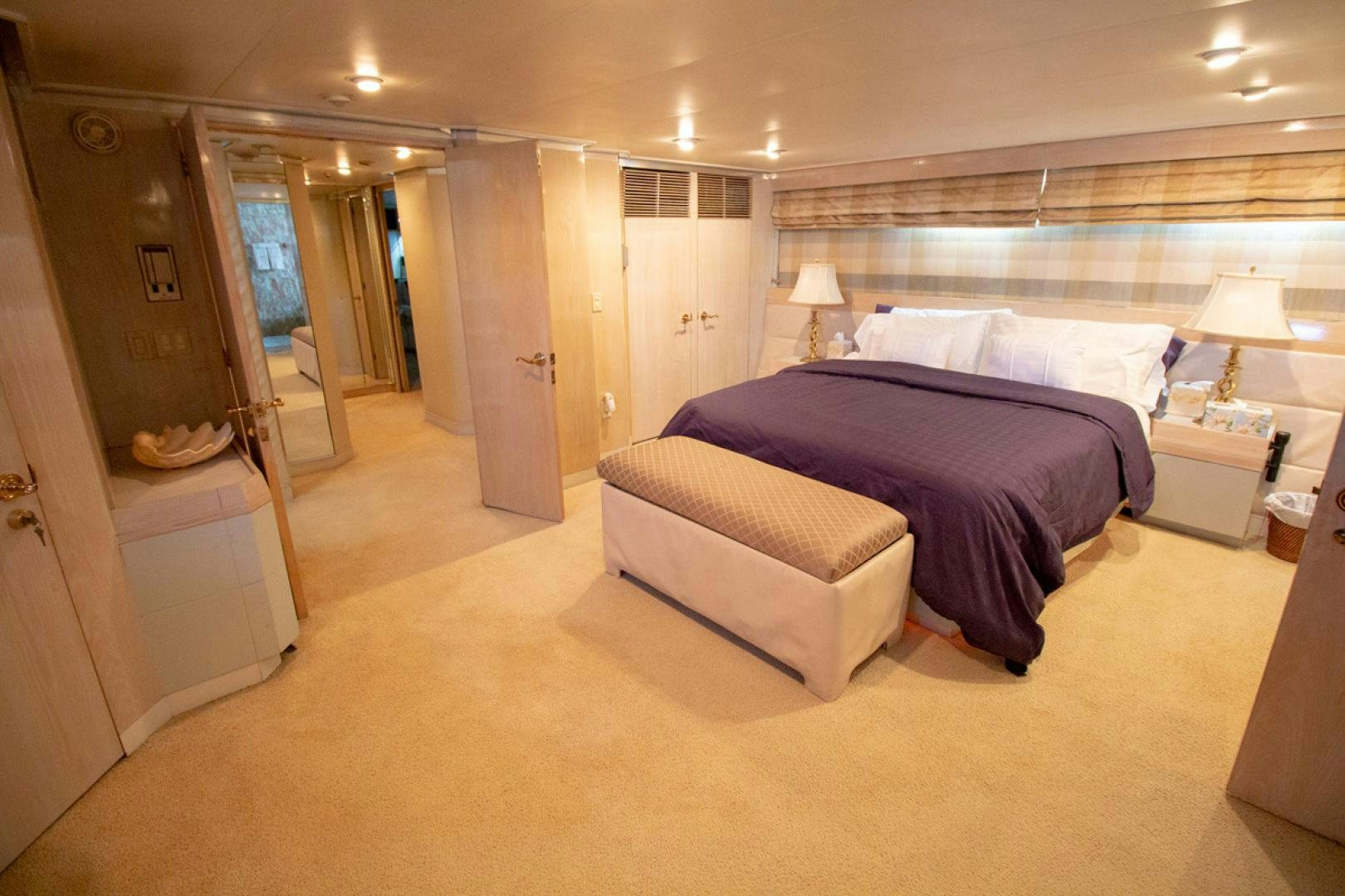 a large bedroom with a large bed aboard LIQUIDITY Yacht for Sale