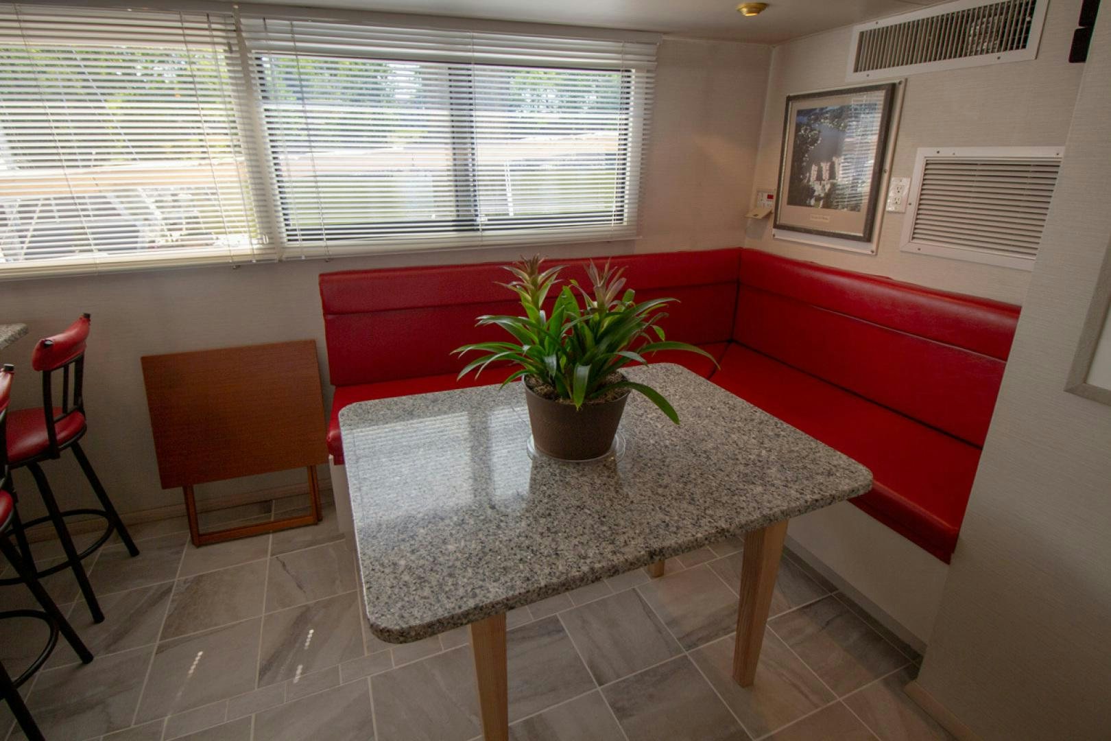 a potted plant on a table aboard LIQUIDITY Yacht for Sale