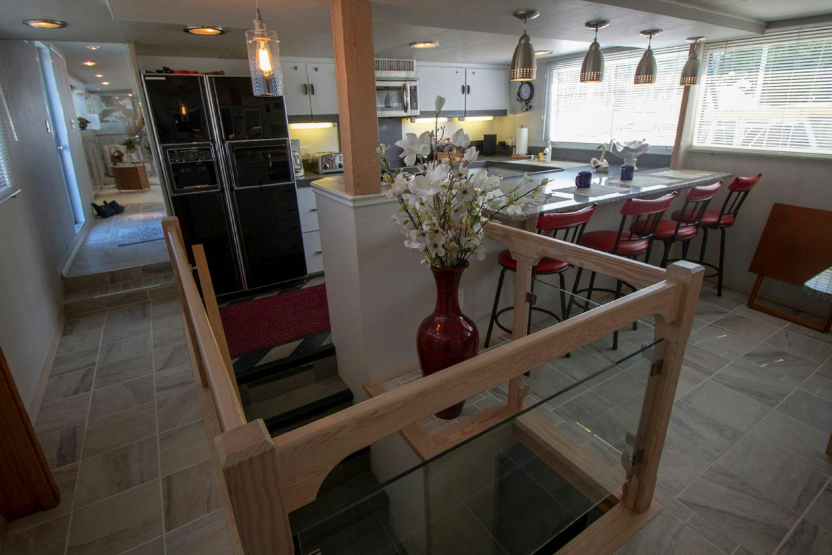 a large room with tables and chairs aboard LIQUIDITY Yacht for Sale