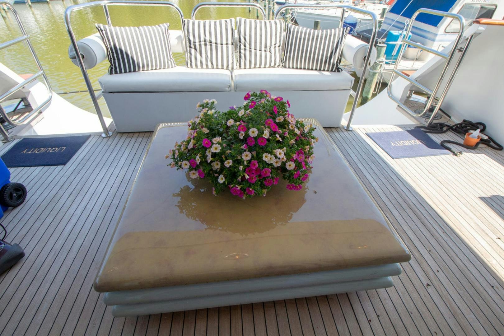 a bouquet of flowers on a table aboard LIQUIDITY Yacht for Sale