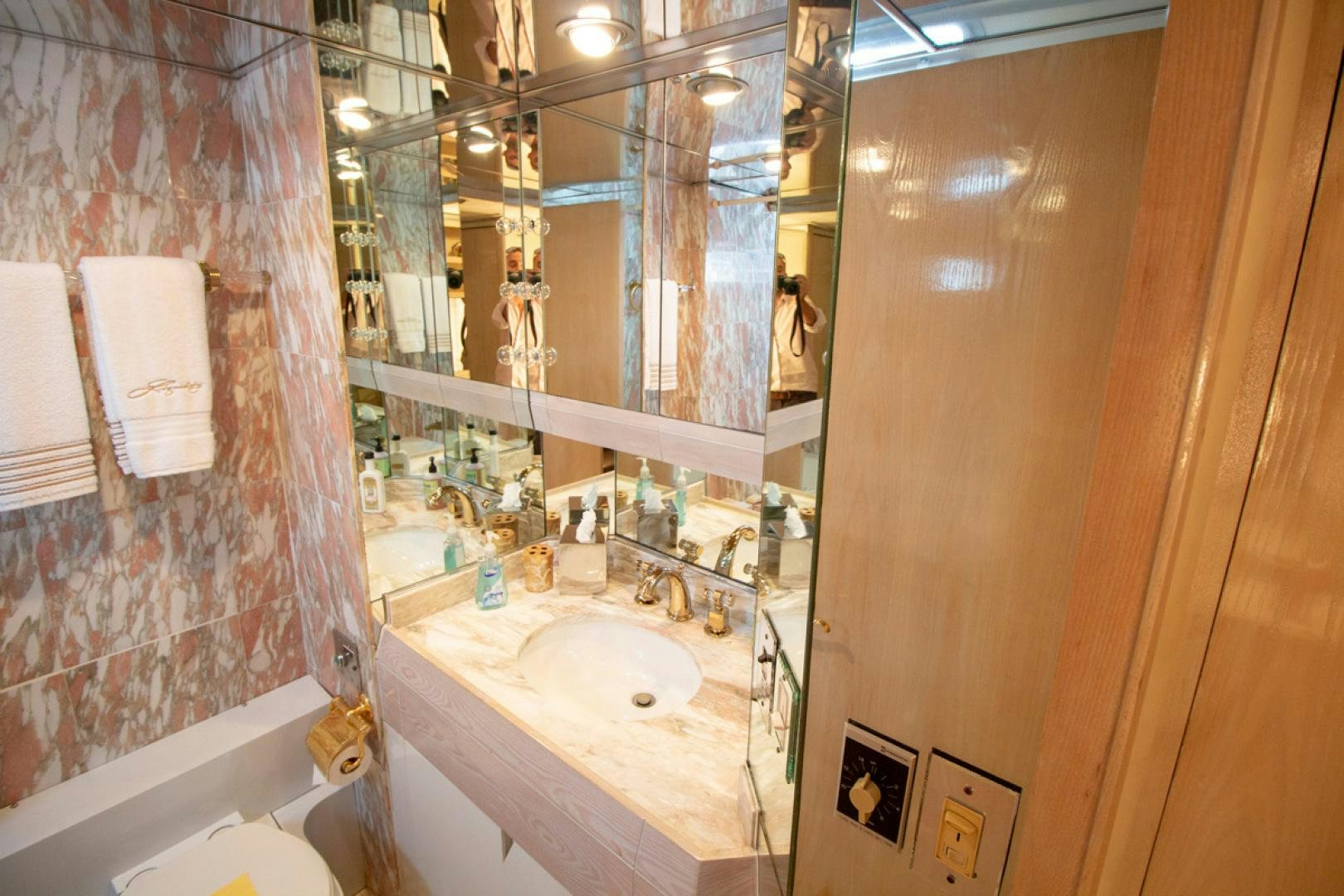 a bathroom with a sink and a mirror aboard LIQUIDITY Yacht for Sale