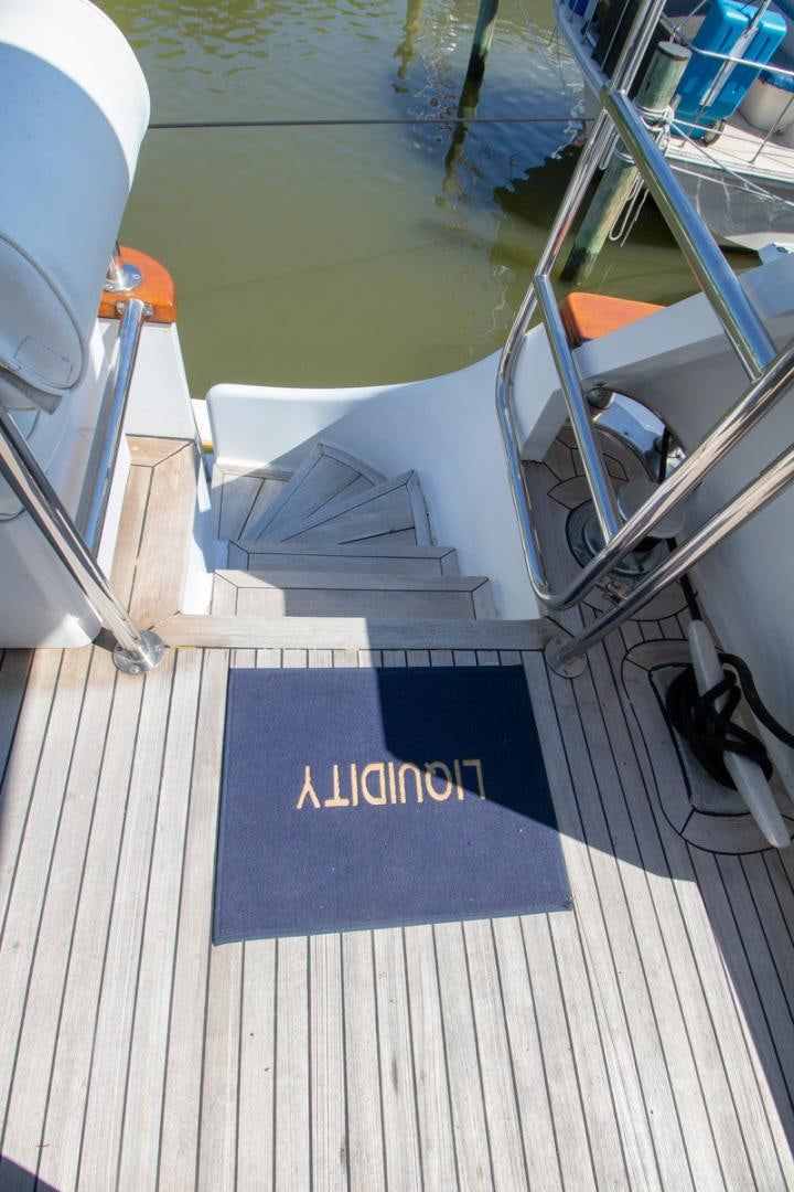a deck with a pool and a deck aboard LIQUIDITY Yacht for Sale