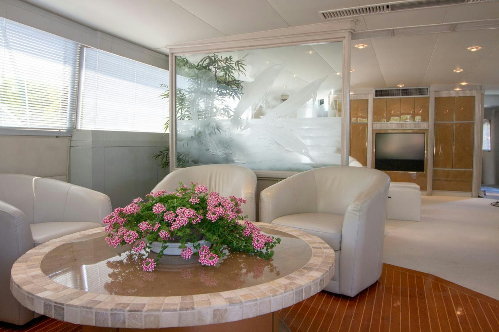 a living room with a table and chairs aboard LIQUIDITY Yacht for Sale