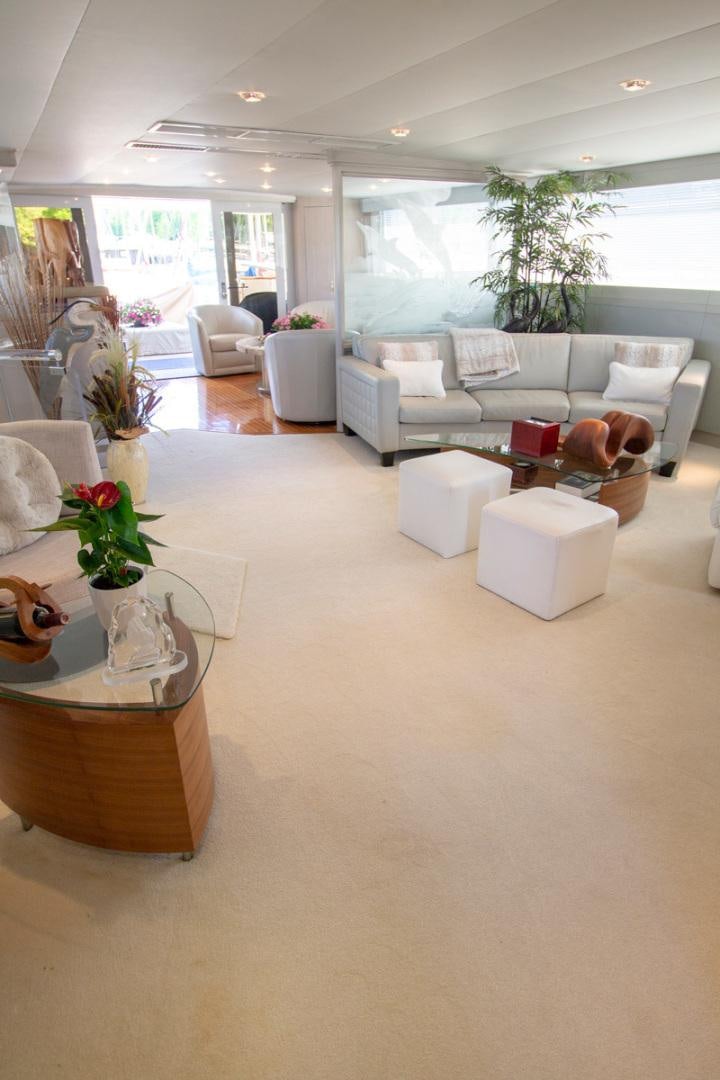 a living room with a large window aboard LIQUIDITY Yacht for Sale