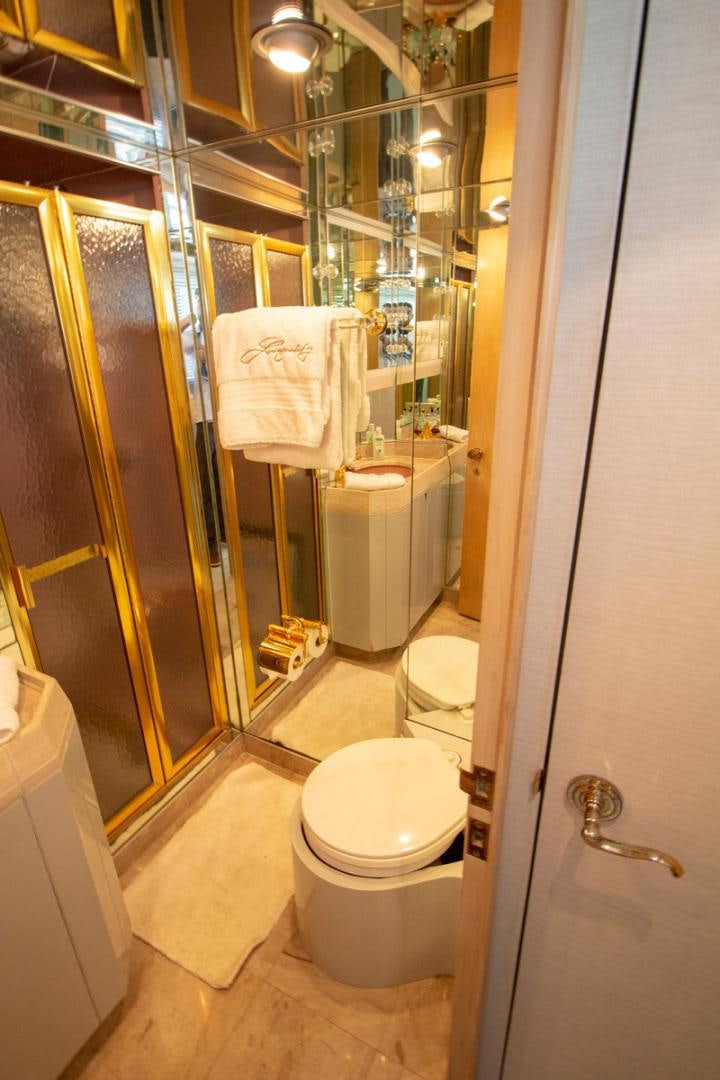 a bathroom with a glass shower aboard LIQUIDITY Yacht for Sale