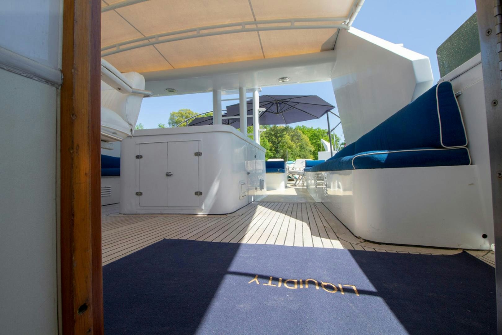 a garage with a garage door open aboard LIQUIDITY Yacht for Sale