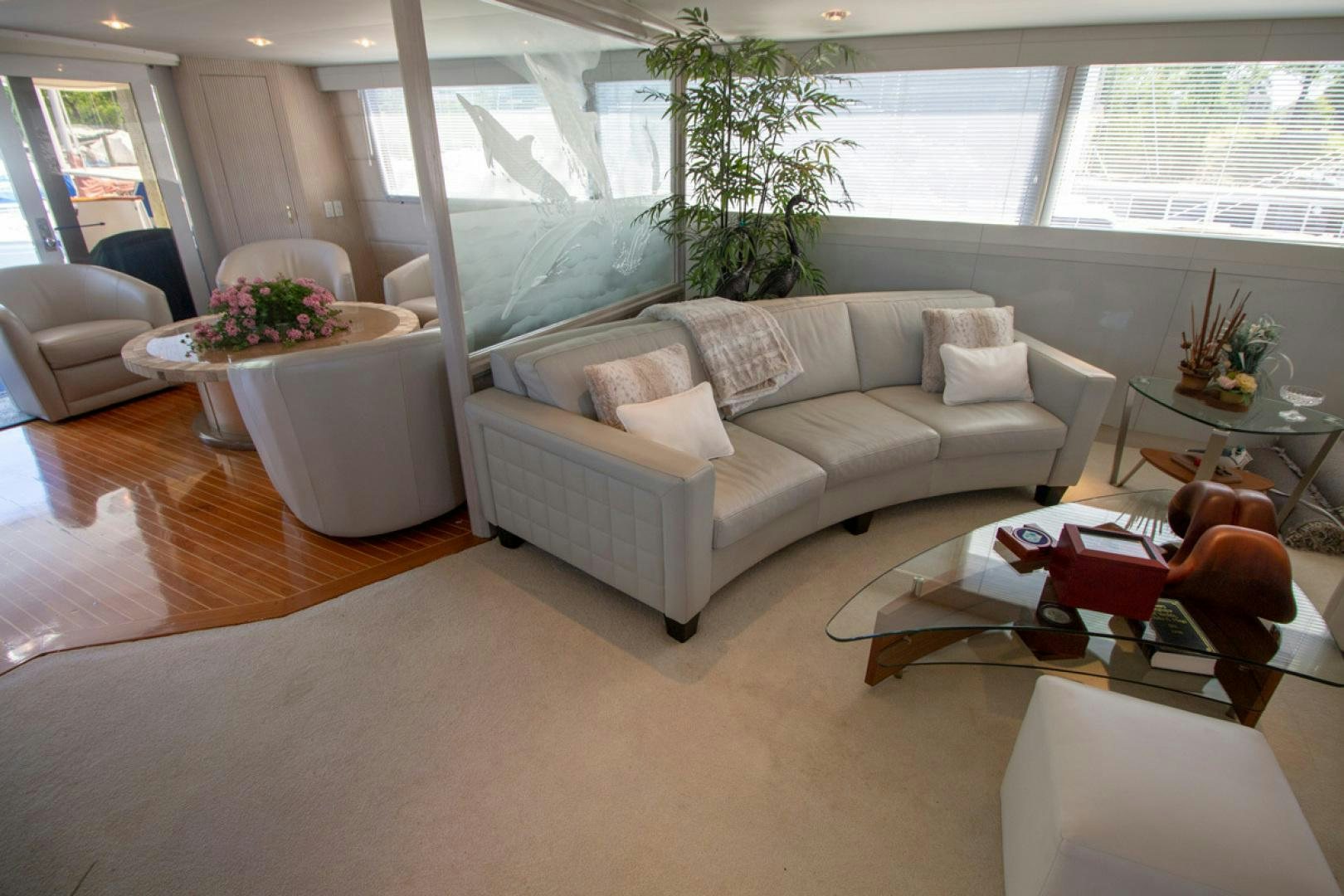 a living room with a couch and a table aboard LIQUIDITY Yacht for Sale