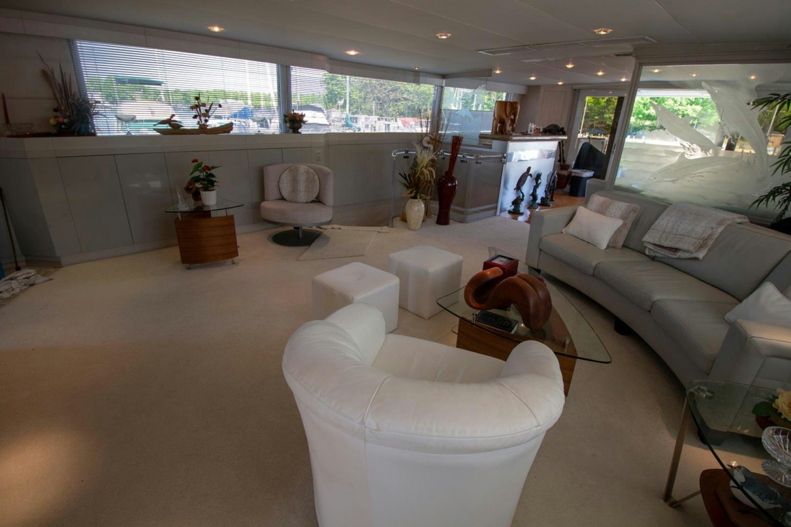 a living room with a couch and a coffee table aboard LIQUIDITY Yacht for Sale