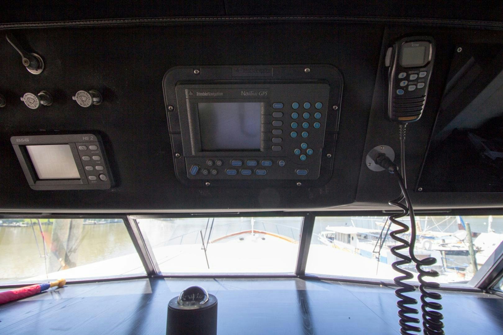 a group of cell phones on a car dashboard aboard LIQUIDITY Yacht for Sale