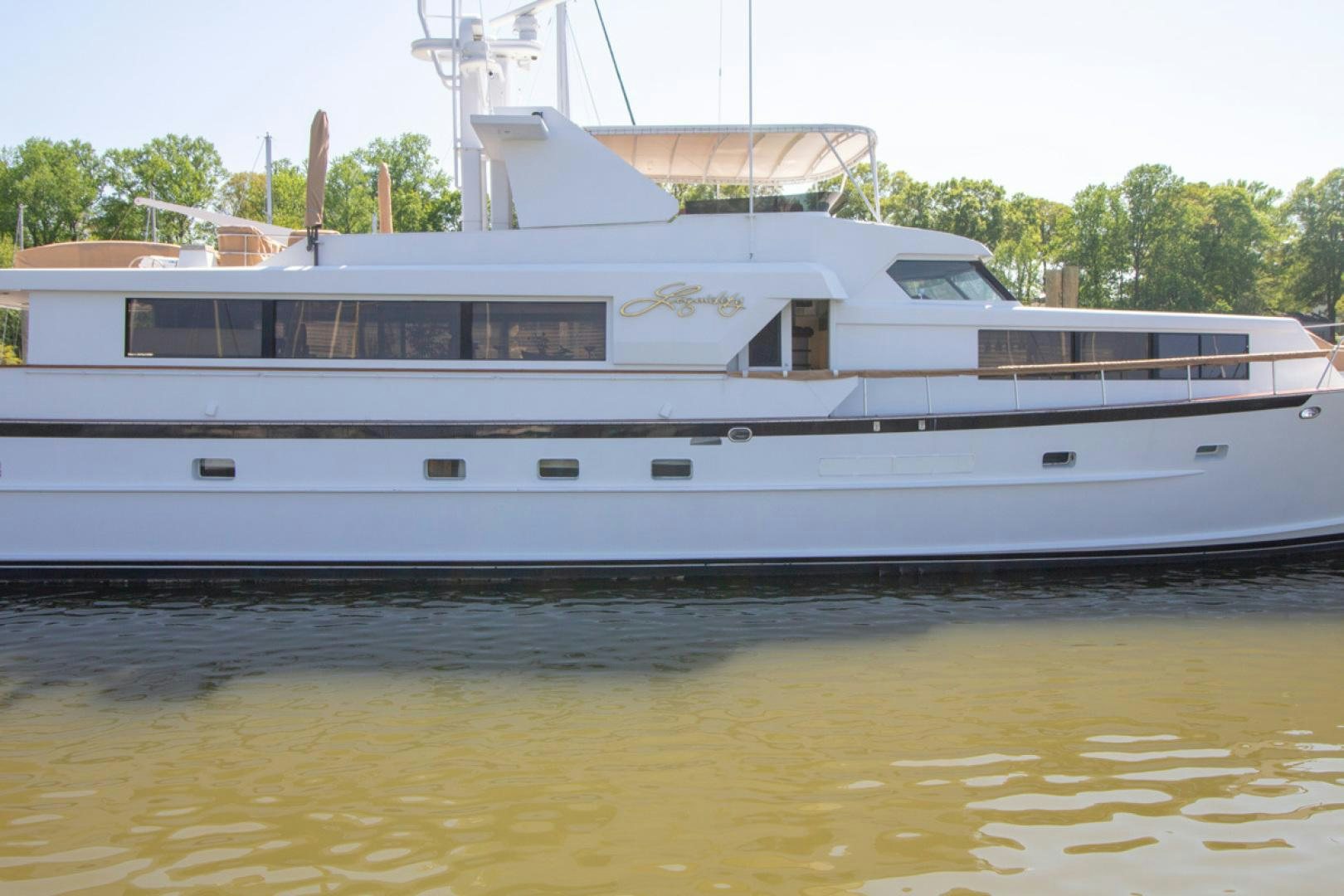 a white boat on the water aboard LIQUIDITY Yacht for Sale