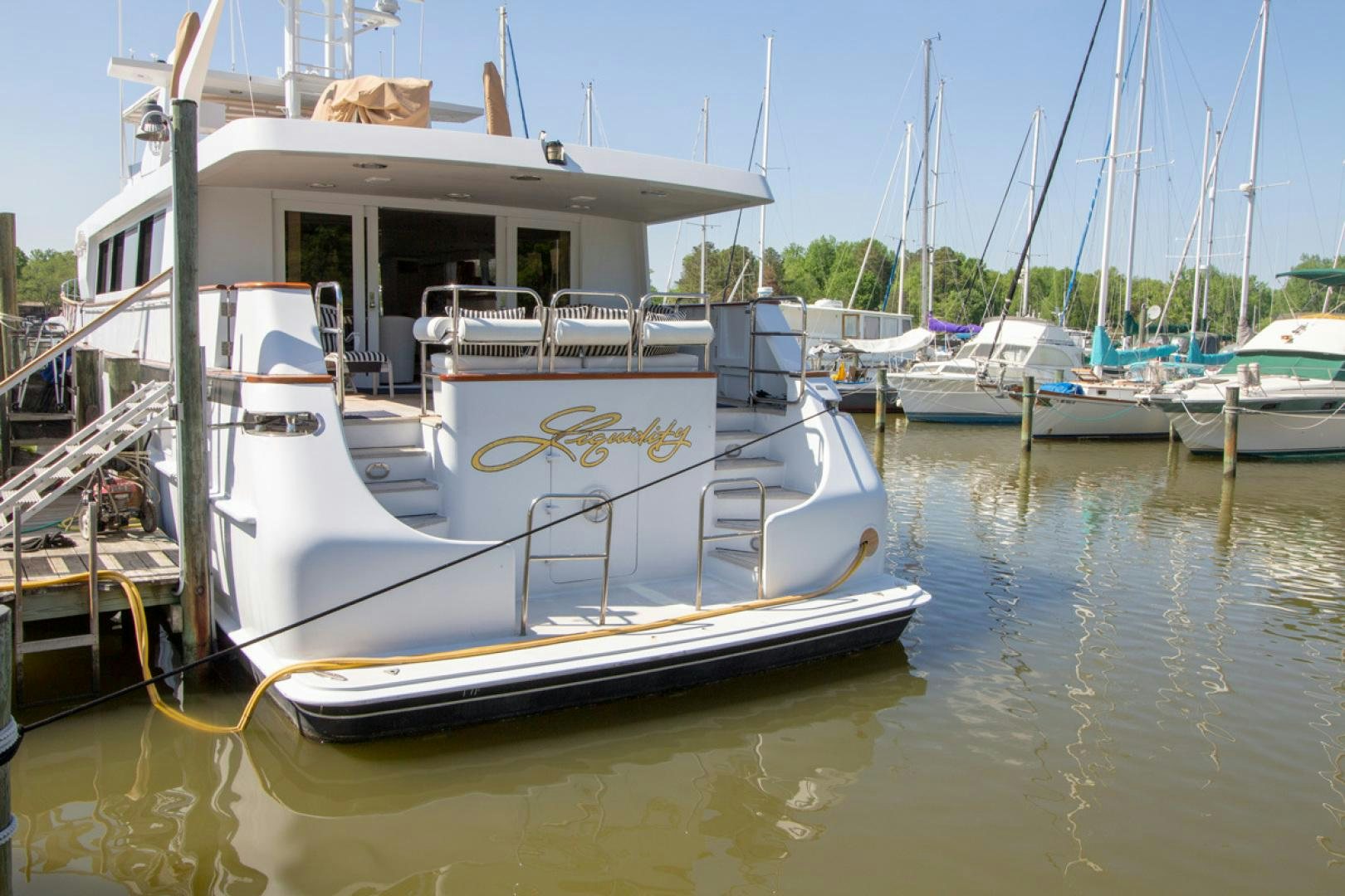 a boat docked at a pier aboard LIQUIDITY Yacht for Sale