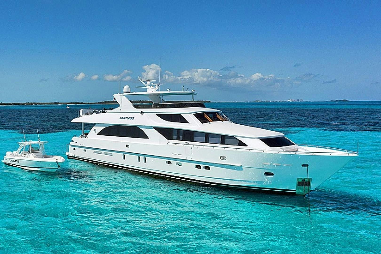 a white yacht in the water aboard LIMITLESS Yacht for Sale