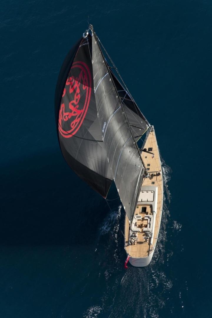 a rocket flying over a body of water aboard DARK SHADOW Yacht for Sale