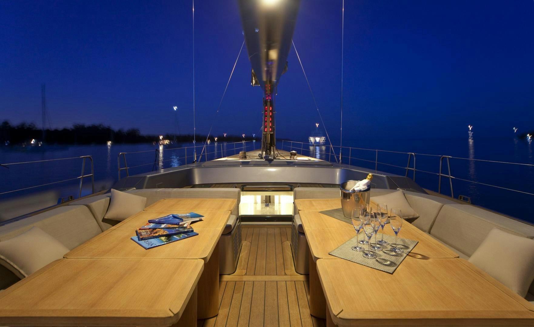 a room with a table and a lamp on the table aboard DARK SHADOW Yacht for Sale